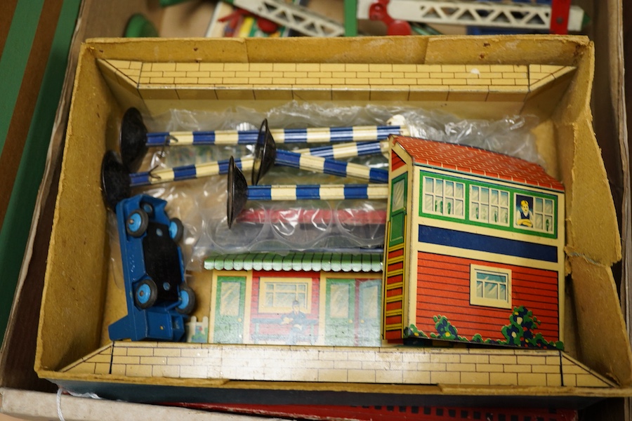 A collection of Hornby 0 gauge tinplate clockwork railway, including; a boxed No.1 Special GWR 0-4-0T locomotive, 5500, complete with original inner card packing pieces, etc., together with a boxed Dinky Toys No.1 Statio